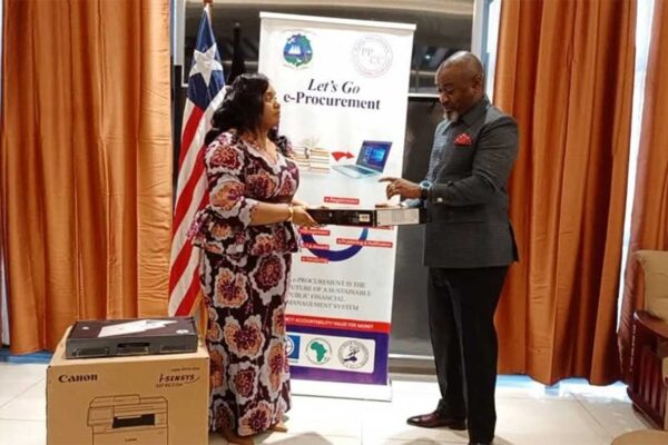 Education-Minister-Jarso-Maley-Jallah-Receives-Equipment-from-Procurement-Boss-Bodger-Scott-Johnson