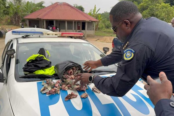 Police-Boss-Displays-Bribes-Discovered-By-Patrol-Officers