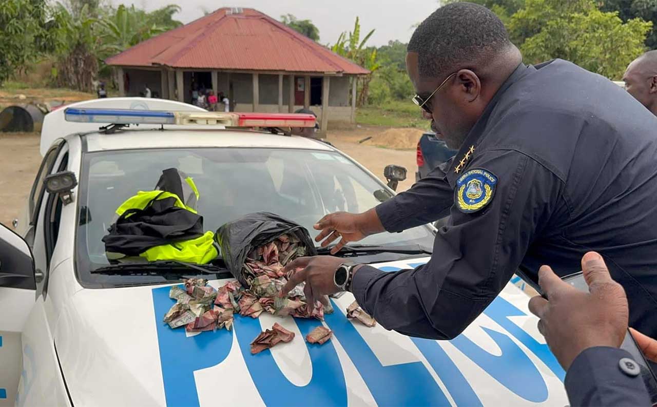 Police-Boss-Displays-Bribes-Discovered-By-Patrol-Officers