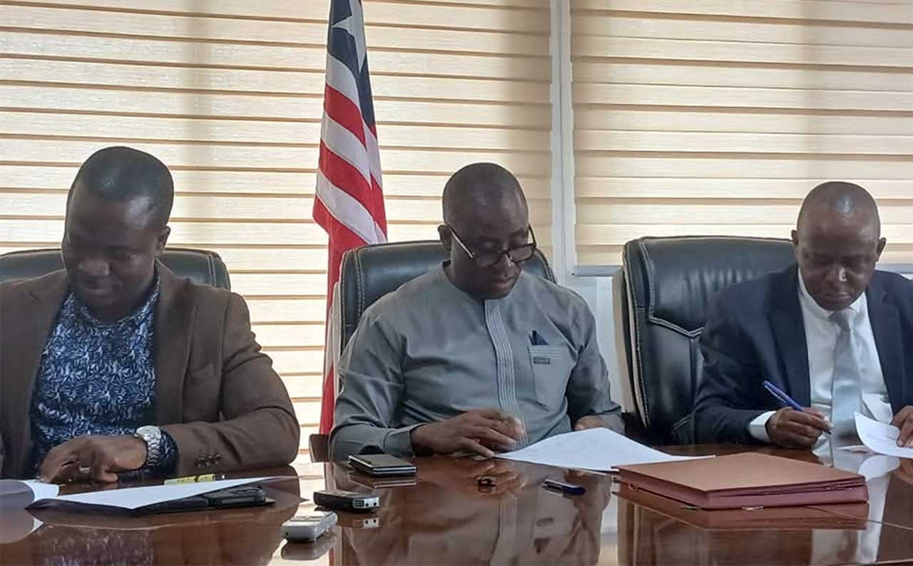 Executive-Director-Andrew-Peters-NIR,-Abdullah-L.-Kamara,-LTA-Acting-Chairman,-and-Abdullah-S.-Swaray,-NICOL-Managing-Director,-signing-for-their-respective-entities.