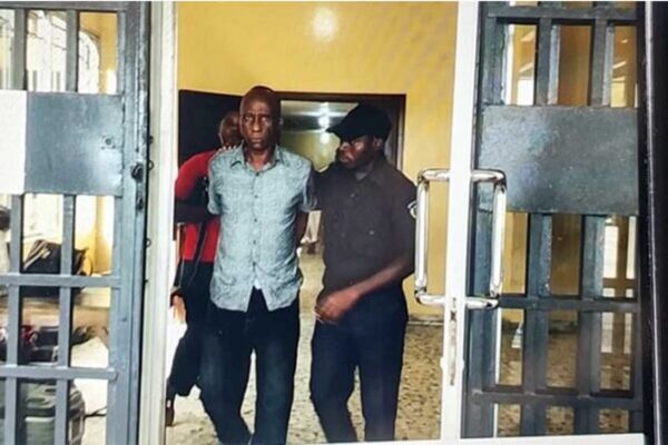 Liberian Man Faces Extradition To America…Over Multiple Rape Charges Othello-Bruce-Leaving-Court-With-Law-Enforcement-Officer-in-Liberia