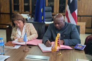 Finance-Minister-Augustine-Kpehe-Ngafuan-and-EU-Ambassador-to-Liberia,-Madam-Nona-Deprez-Sign-Agreement