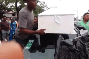 Police-Officers-Taking-Hold-Of-Woman’s-Coffin