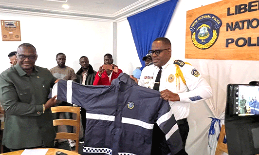 Senator-Cyrus-and-IGP-Coleman-displaying-a-rain-gear