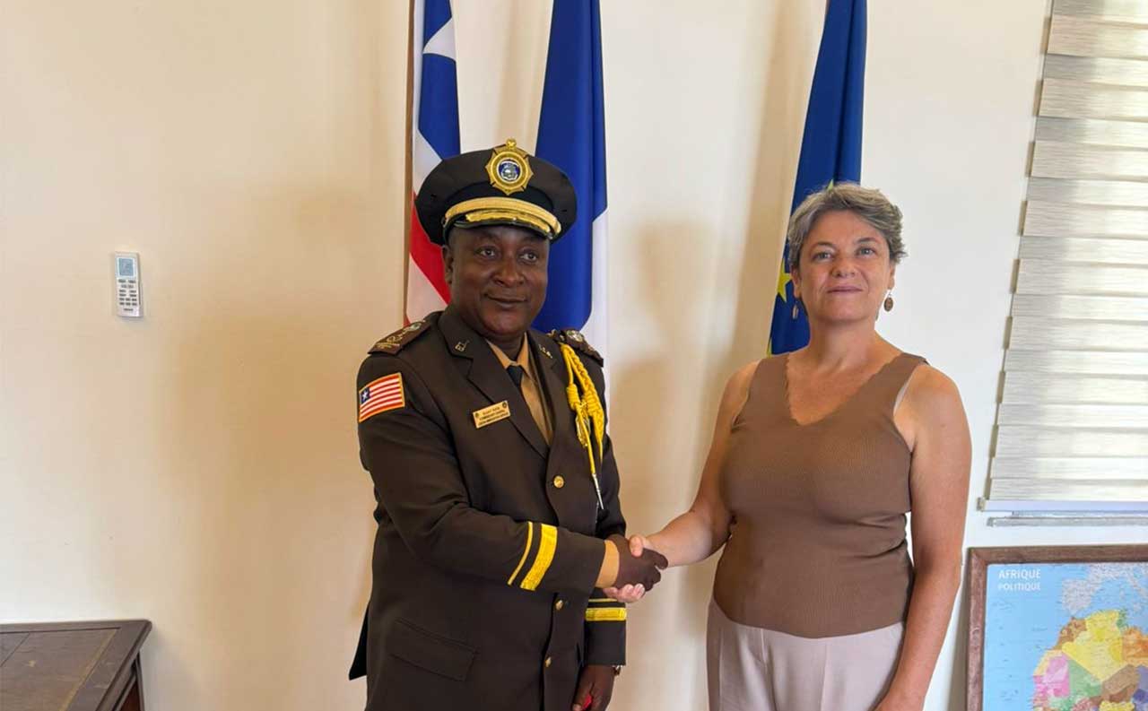 Ambassador-of-France-to-Liberia,-Madam-Isabelle-LE-GUELLEC,-And-Liberian-Commissioner-General-of-Immigration,-Colonel-Elijah-Rufus-Exchange-Handshake