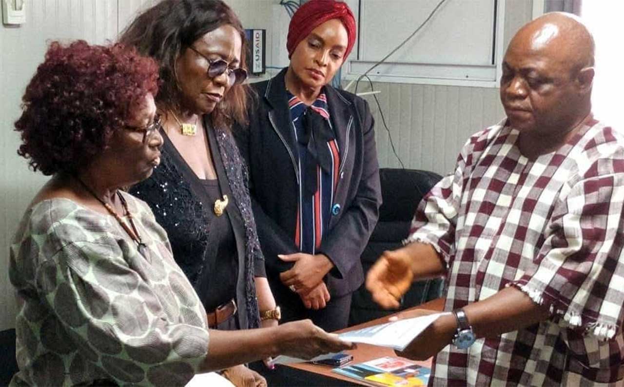 Madam-Davidetta-Browne-Lansanah-turn-over-leadership-to-Acting-Chairperson,-Mr.-Jonathan-K.-Weedor